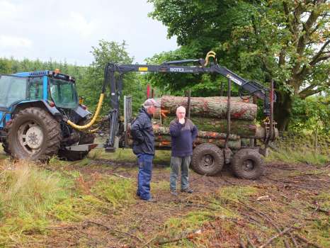 Gary and John by the much smaller forwarder John used to take timber from our wood